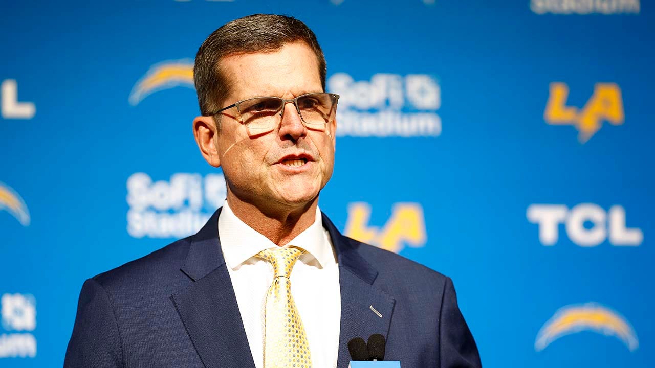 Chargers coach Jim Harbaugh to serve as honorary captain at Michigan's season opener despite NCAA penalties