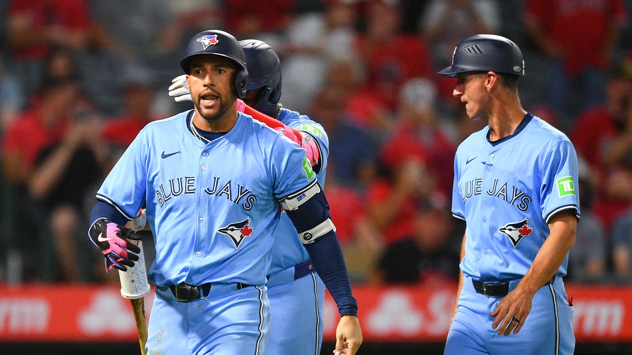 George Springer of the Blue Jays yells at referee after sending off and has to be restrained