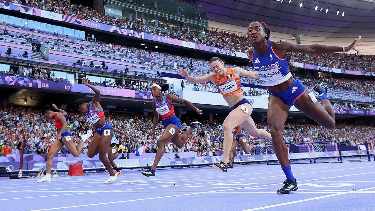 Masai Russell Wins Gold in 100m Hurdles