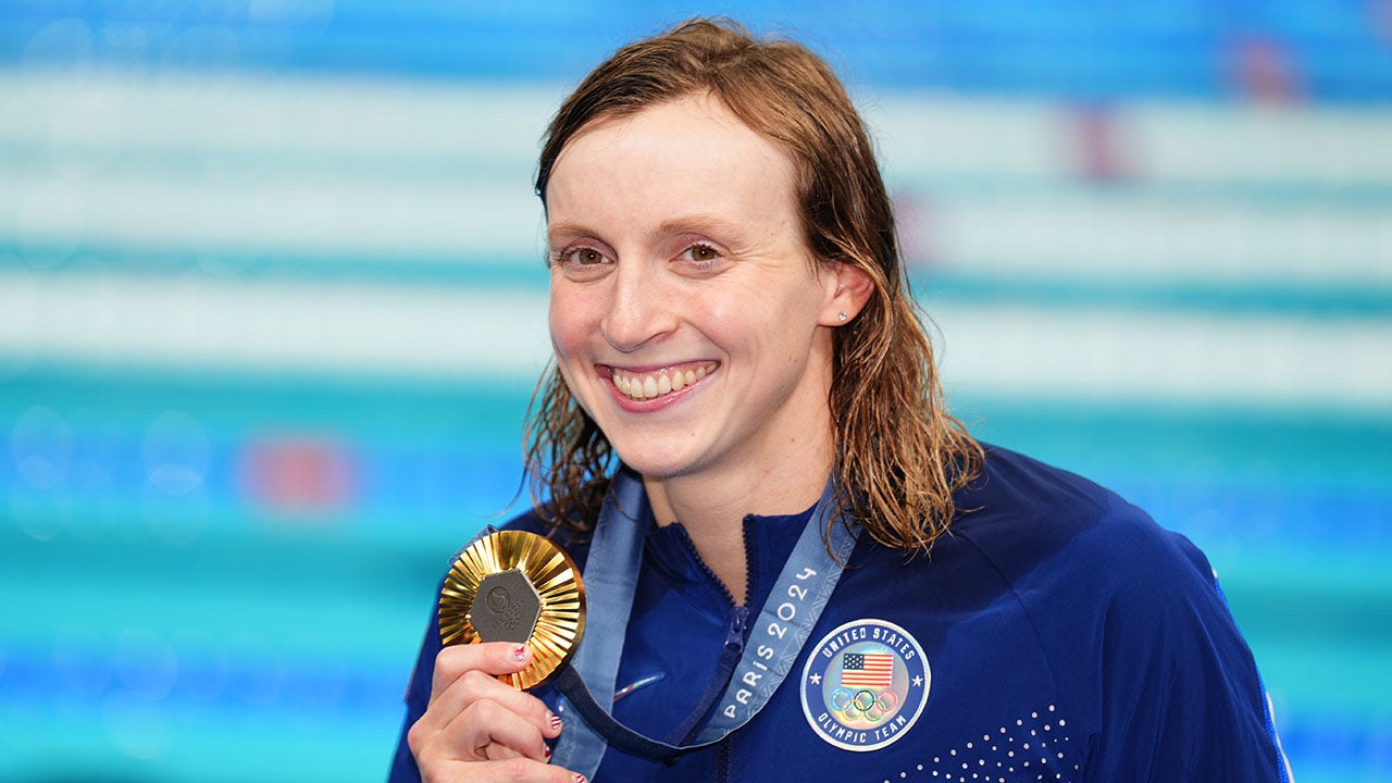 USA's Katie Ledecky poses with her gold medal after winning the women's 800m freestyle final at the Paris La Defense Arena on the eighth day of the 2024 Paris Olympic Games in France. The athlete recently shared her POTS diagnosis with the world. (John Walton/PA Images via Getty Images)