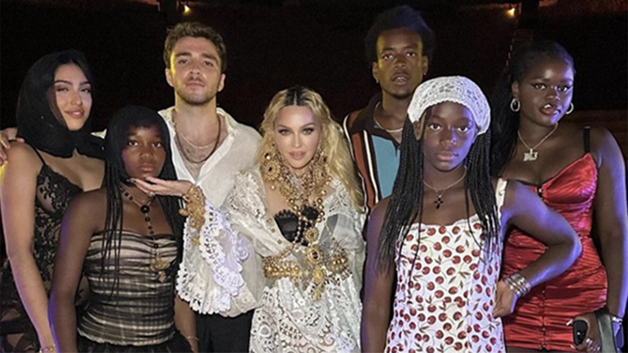 Madonna poses with her 6 children on vacation in Italy