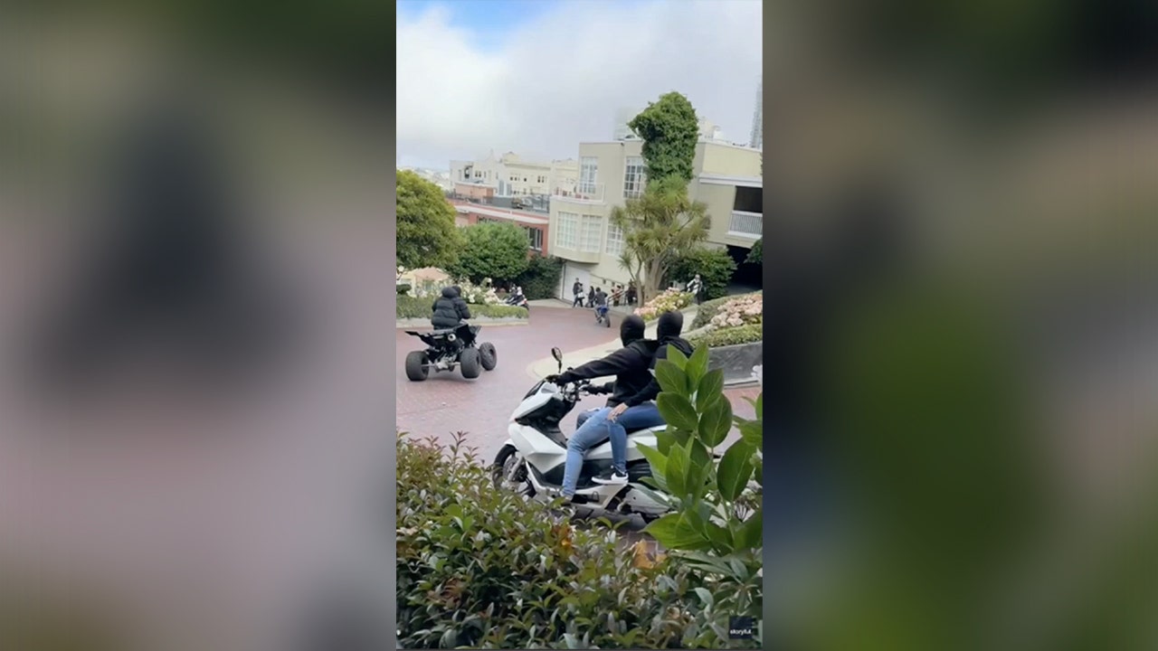 WATCH: San Francisco traffic officer circled by masked motorcyclists in tourist area