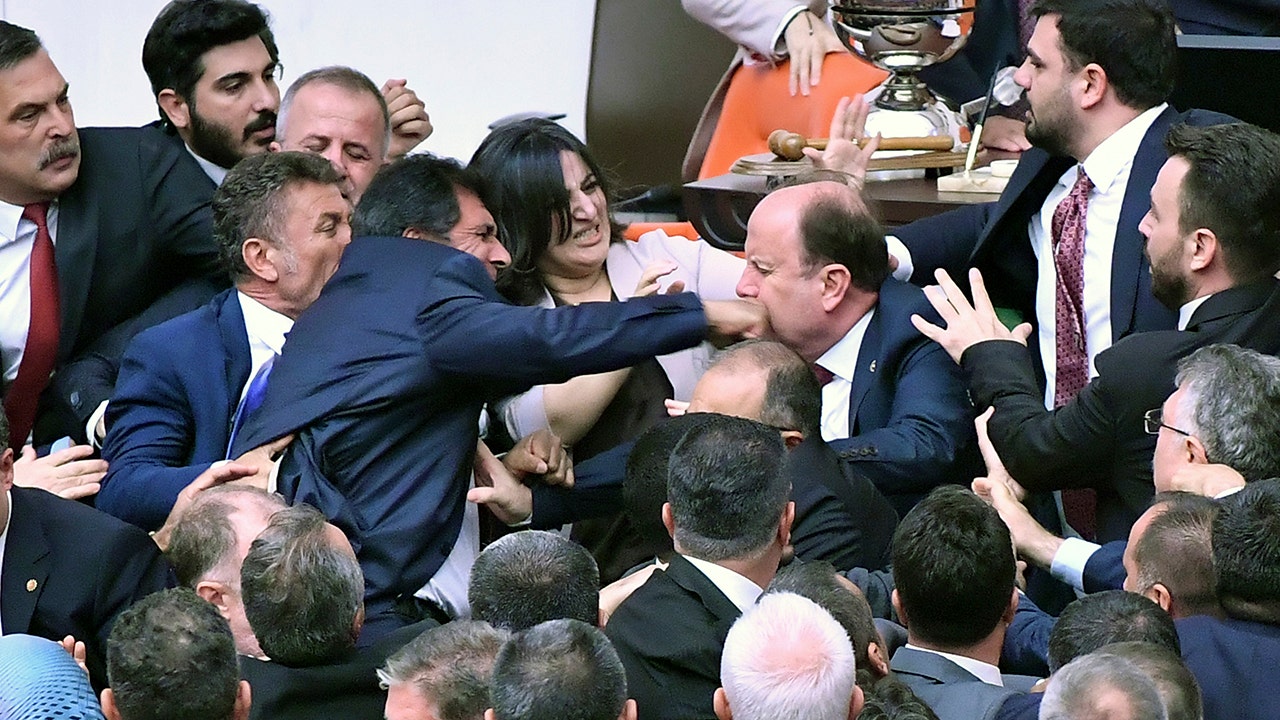 Chaotic and bloody clashes break out in the Turkish parliament over imprisoned opposition leader