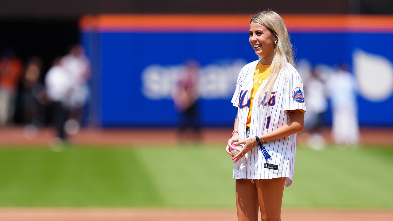 “Hawk Tuah Girl” reacts after her first pitch sparked a fierce reaction from Mets fans