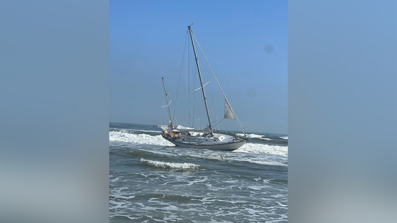 Pair rescued from disabled sailboat off popular beach