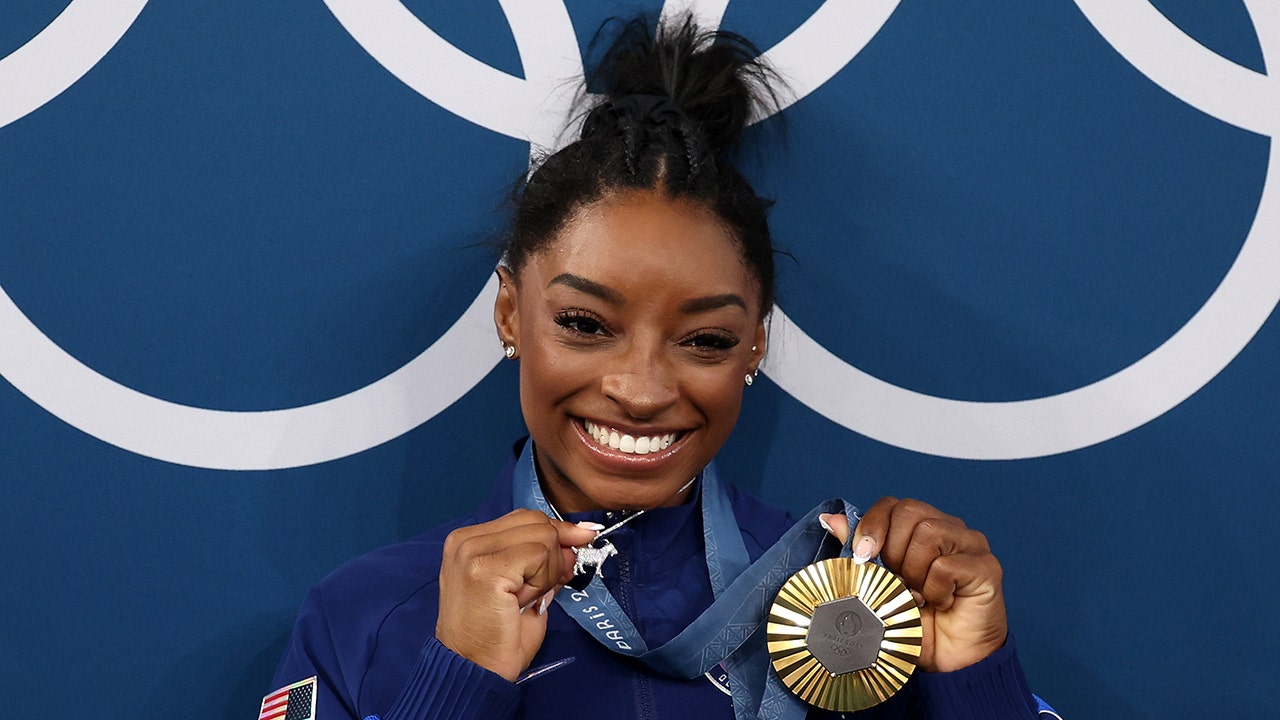 Simone Biles acknowledges diamond-studded GOAT necklace ‘p—es people off’