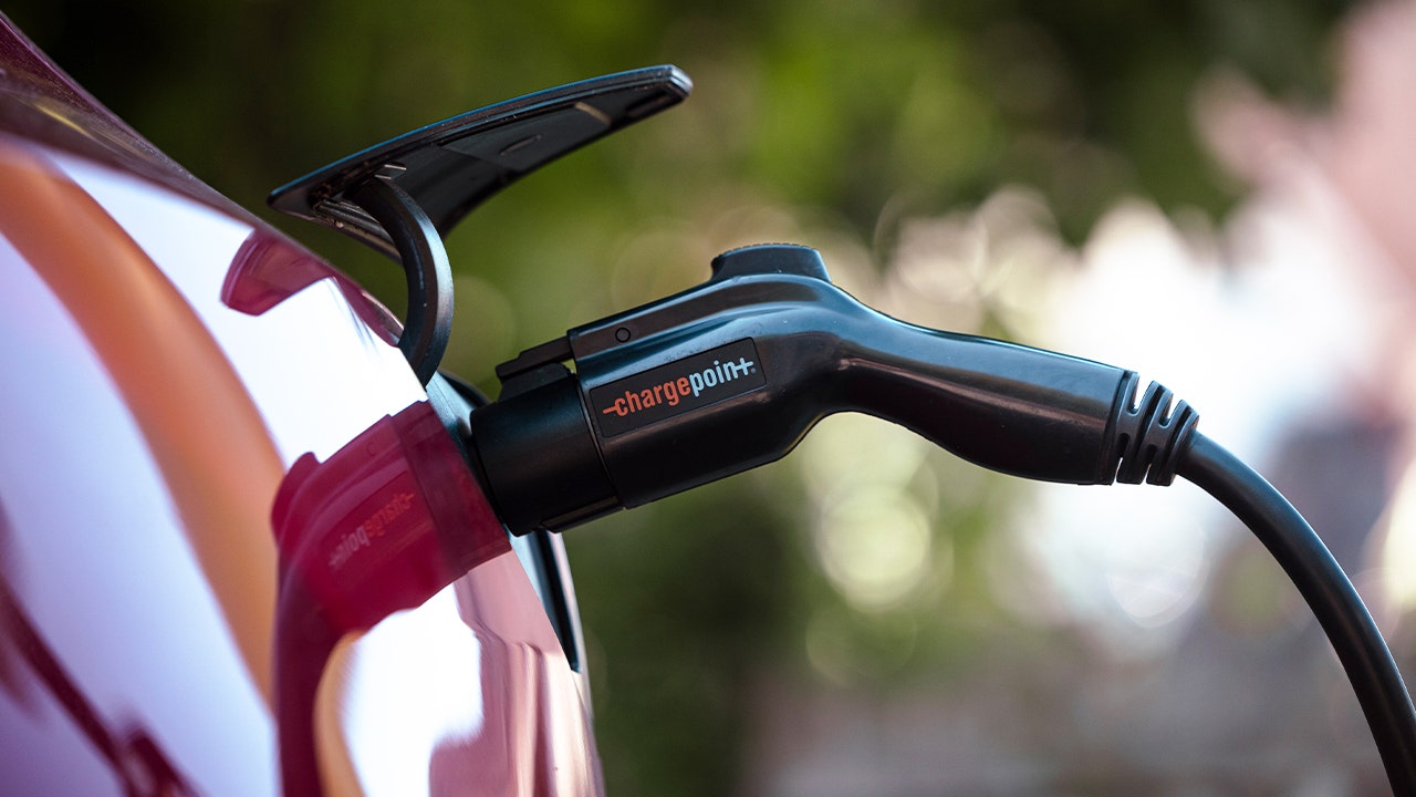 A Tesla Model 3 charges at a ChargePoint electric vehicle charging station in Rhinebeck, New York, on Tuesday, Sept. 3, 2024. (Angus Mordant)