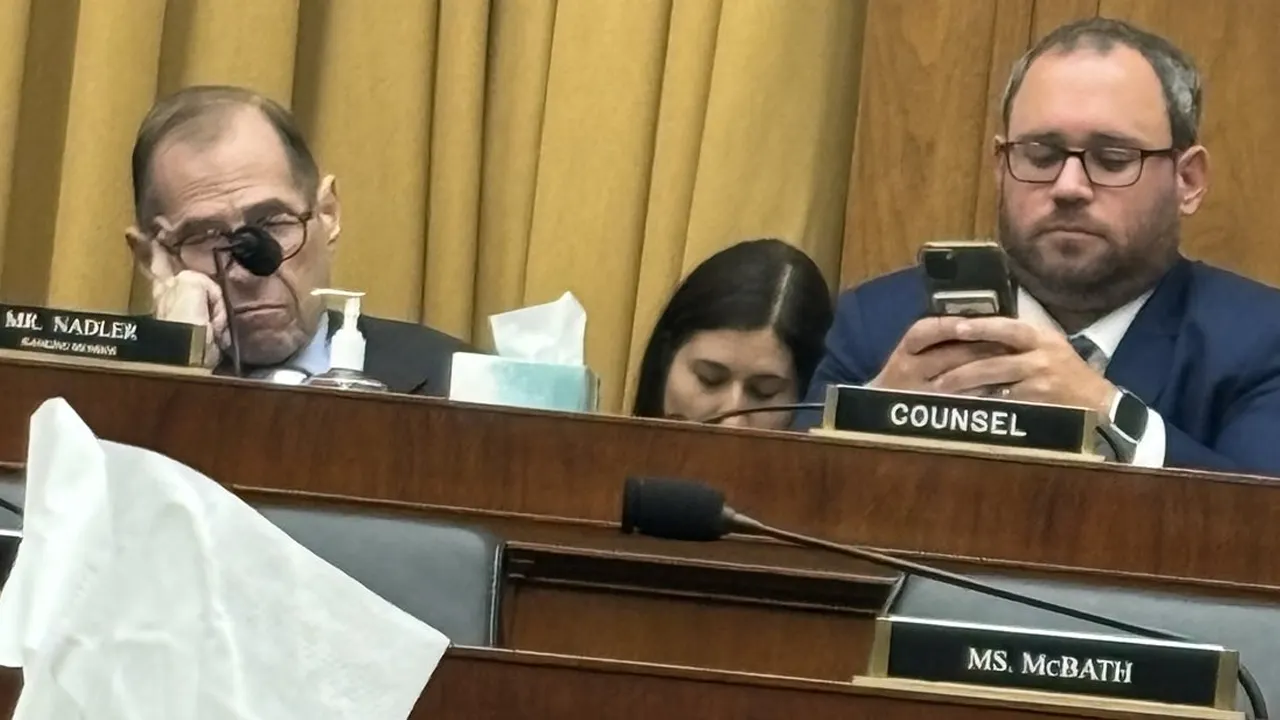 Democratic Representative Nadler is pictured with his head bowed and eyes closed during testimony from mothers of migrant victims.