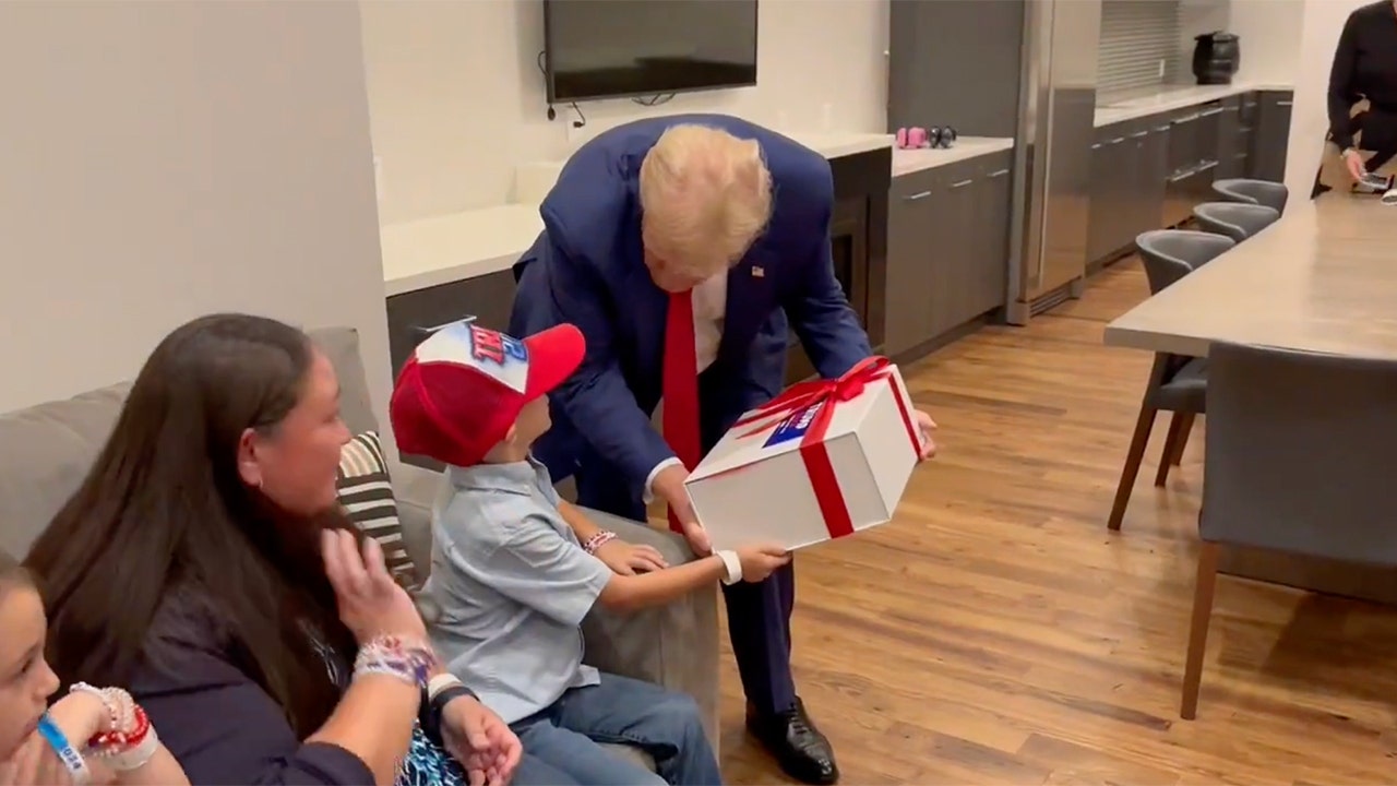 SEE IT: Trump meets young supporter with rare brain disease backstage at rally