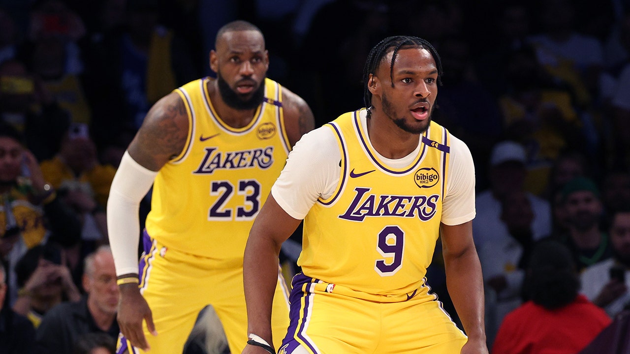 Mic’d up LeBron James gives advice to son Bronny on bench before historic NBA debut