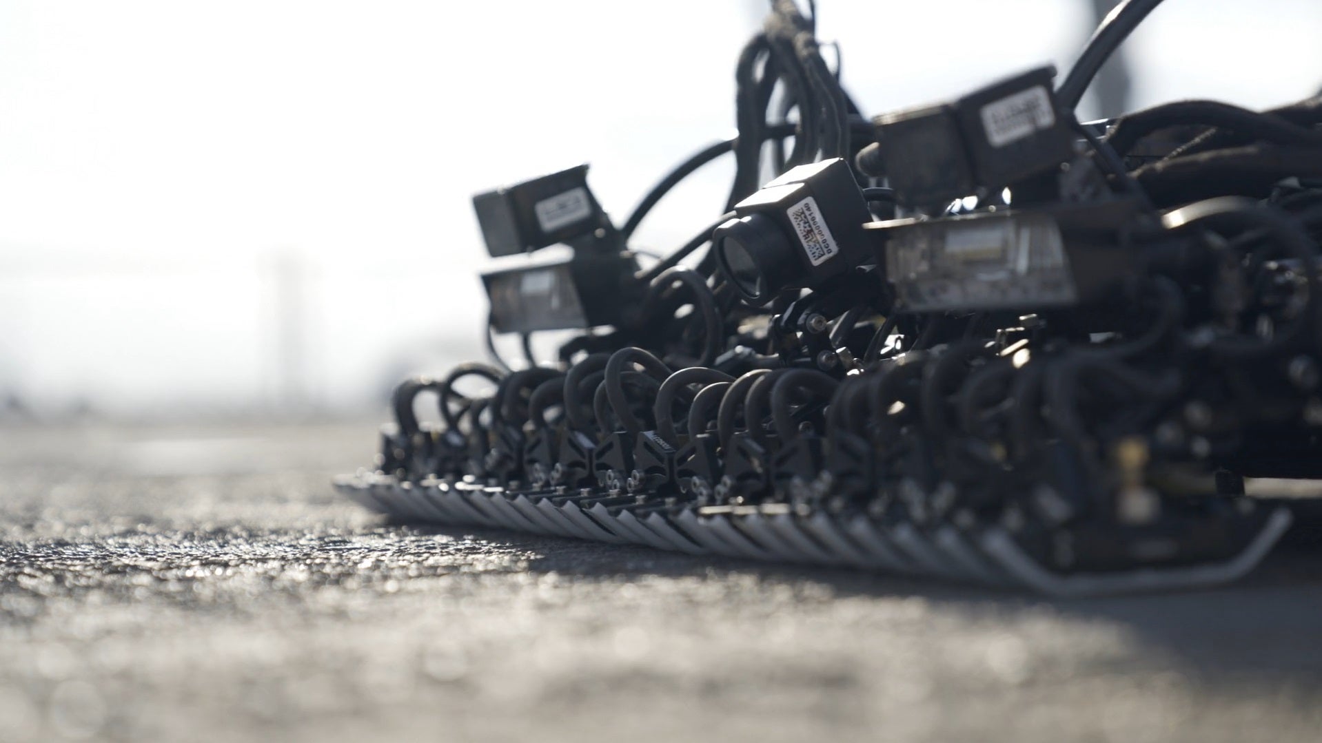 Close-up of a Gecko Robotics unit as it crawls across a Carrier deck. (Gecko Robotics)