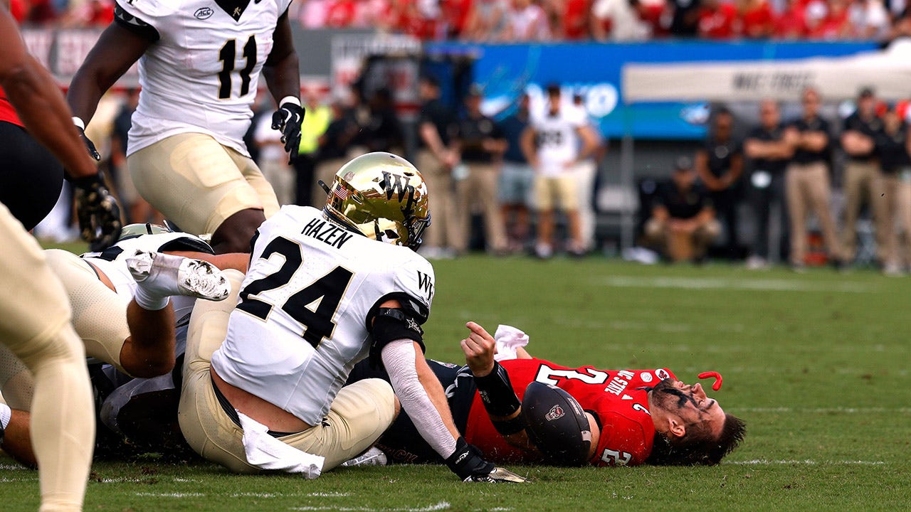 NC State quarterback Grayson McCall was carted off the field after a scary hit sent his helmet flying