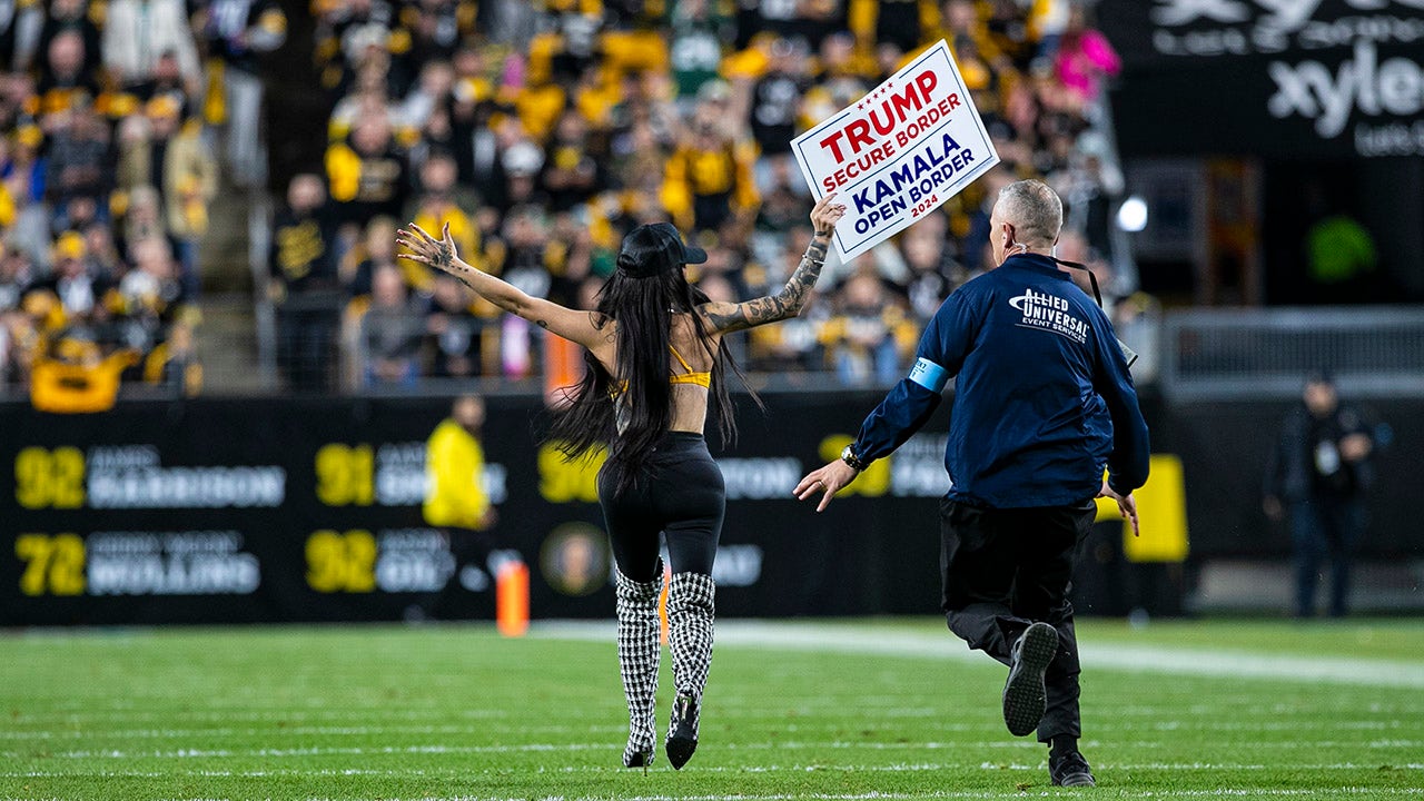 Woman runs onto Steelers field with pro-Trump sign as former president attends game