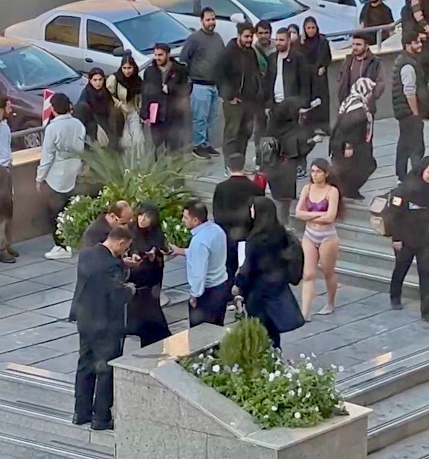 Iranian woman strips down in anti-hijab protest following vicious assault by regime militia