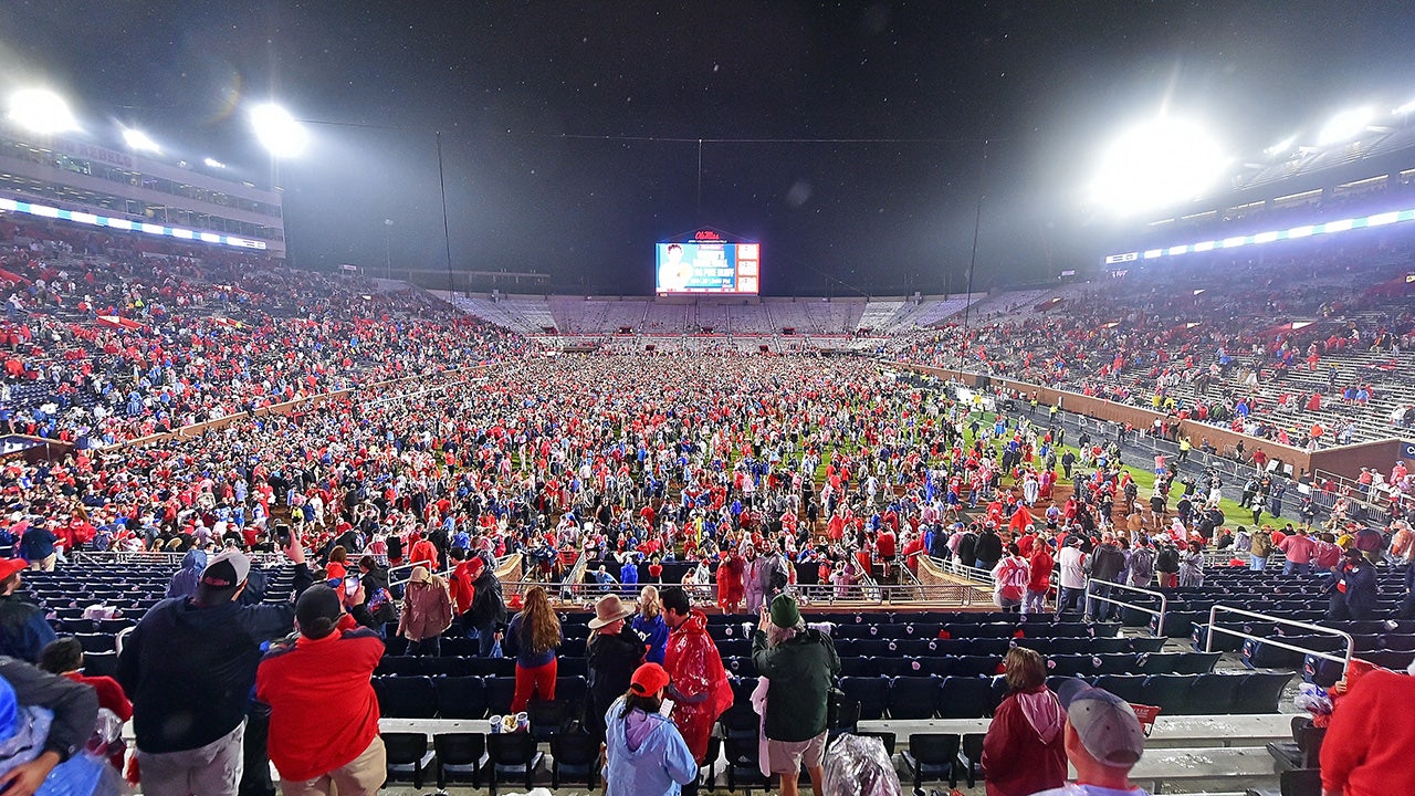 Ole Miss fans storm field with time remaining on clock, prompting delay to game’s end