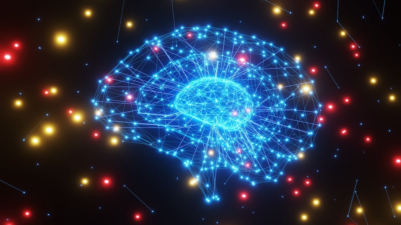 Network of mesh lines forming brains of different sizes in dark background with red and yellow glowing particles. Illustration of the concept of artificial intelligence, ideas and creativity