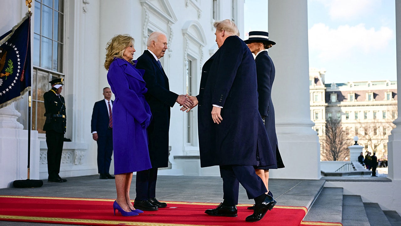 US President Joe Biden and First Lady Jill Biden greet President-elect Donald Trump and Melania Trump as they arrive at the White House in Washington, DC, on January 20, 2025, before departing for the US Capitol where Trump will be sworn in as the 47th US President. (Jim Watson / AFP via Getty Images)