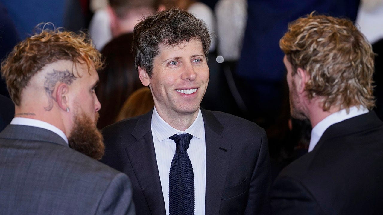 Open AI CEO Sam Altman, center, speaks with boxer Jake Paul and wrestler Logan Paul in Emancipation Hall at the 60th Presidential Inauguration, Monday, Jan. 20, 2025, at the U.S. Capitol in Washington. (Al Drago/Pool Photo via AP)