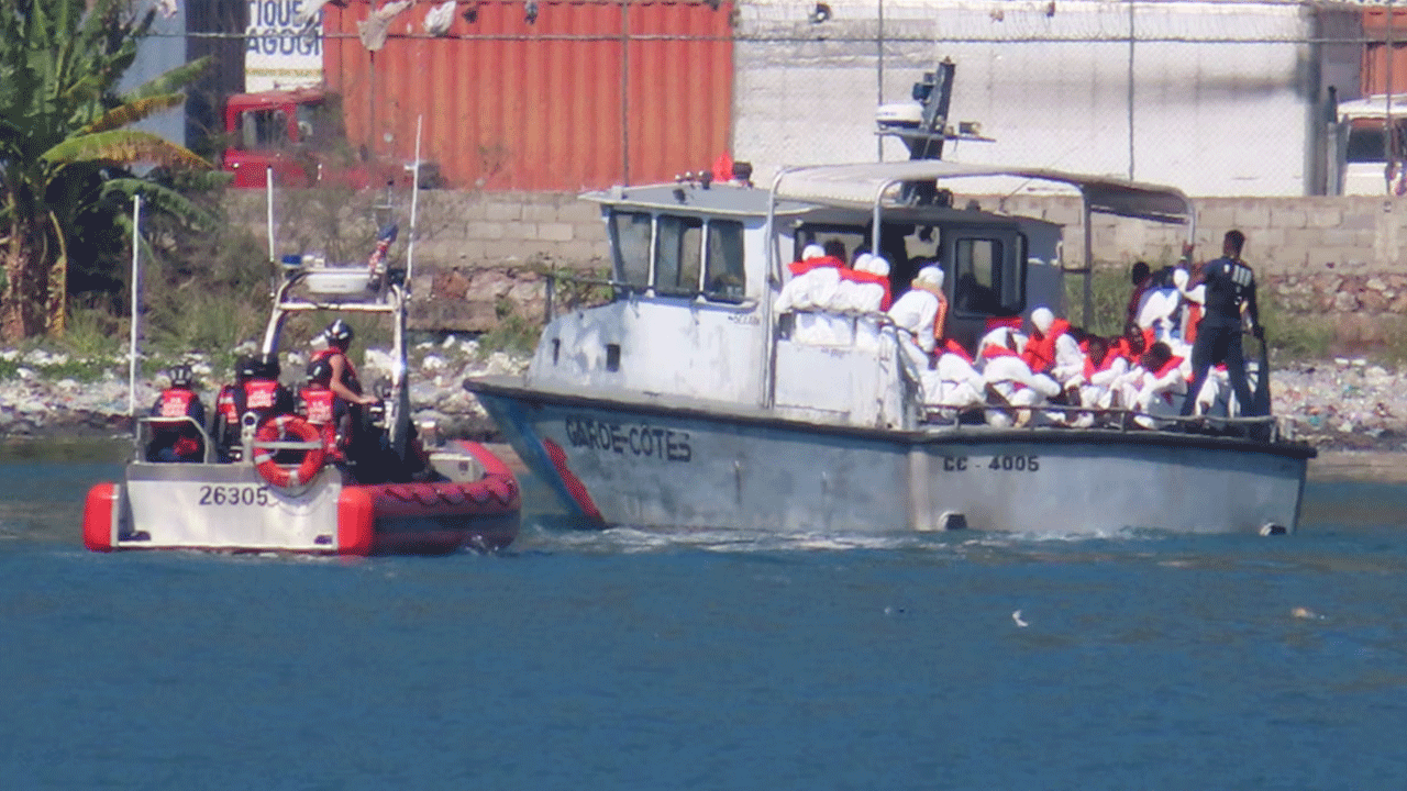 Coast Guard crew approaching Haitian vessel