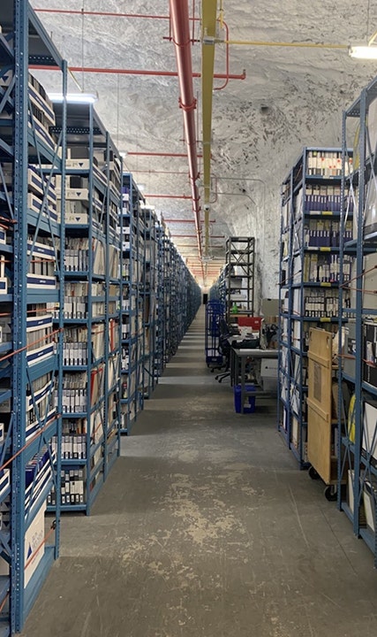 This photo posted by DOGE on Feb. 11, 2025, shows shelving and cardboard boxes which DODGE says workers at the underground mine facility use to store federal worker retirement papers. (DOGE / X)
