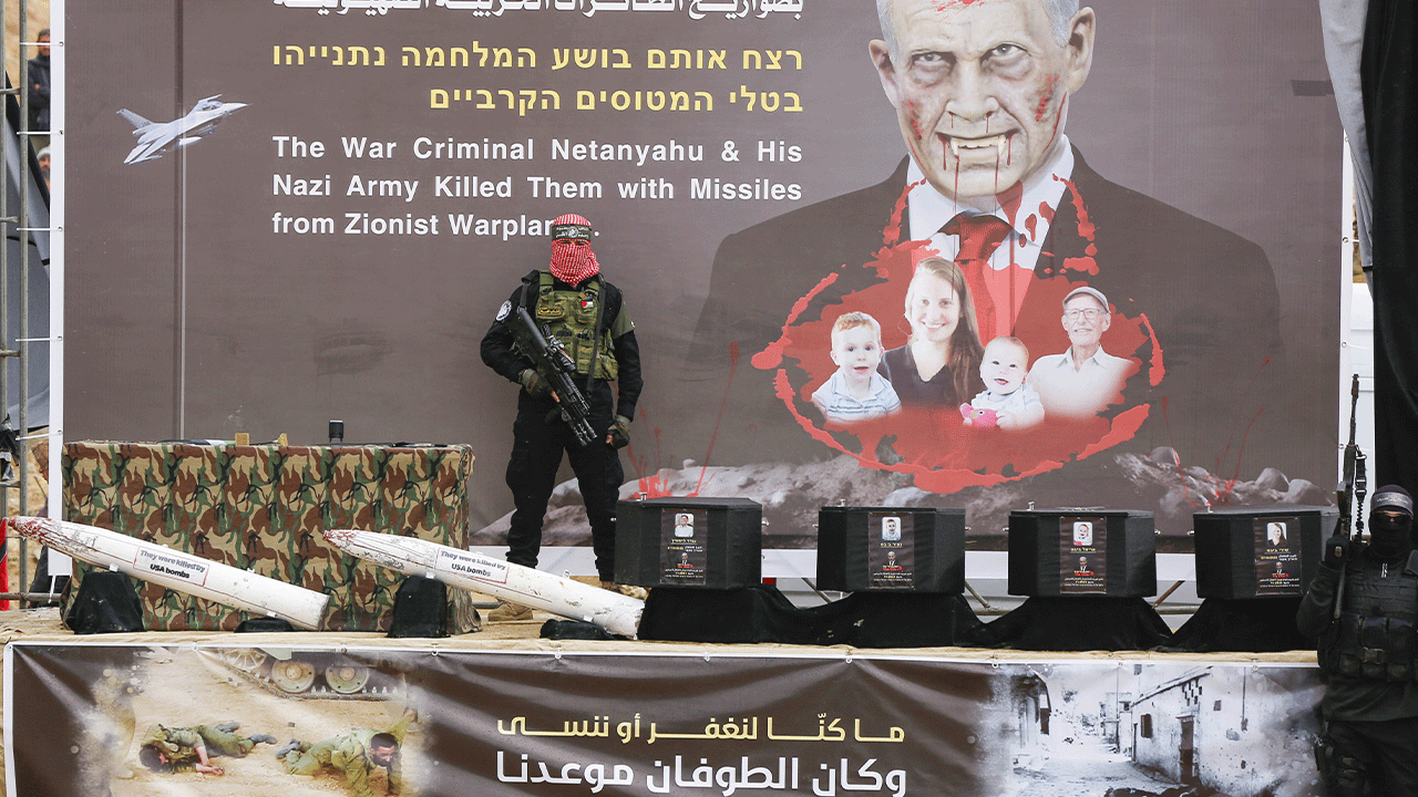 Coffins on the stage of Gaza with Hamas Member