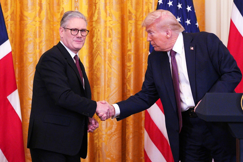 Britain's Prime Minister Keir Starmer, left, and President Donald Trump shake hands at a joint press conference in the East Room at the White House Feb. 27, 2025, in Washington. (Carl Court/Pool Photo via AP)