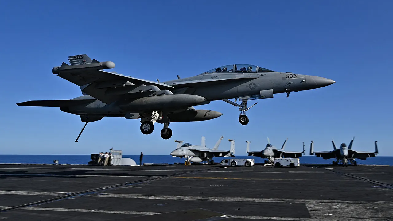 An F/A-18 Hornet fighter jet is seen landing on the deck of the USS Harry S. Truman during a NATO exercise in May 2022. (Andreas Solero/AFP via Getty Images)