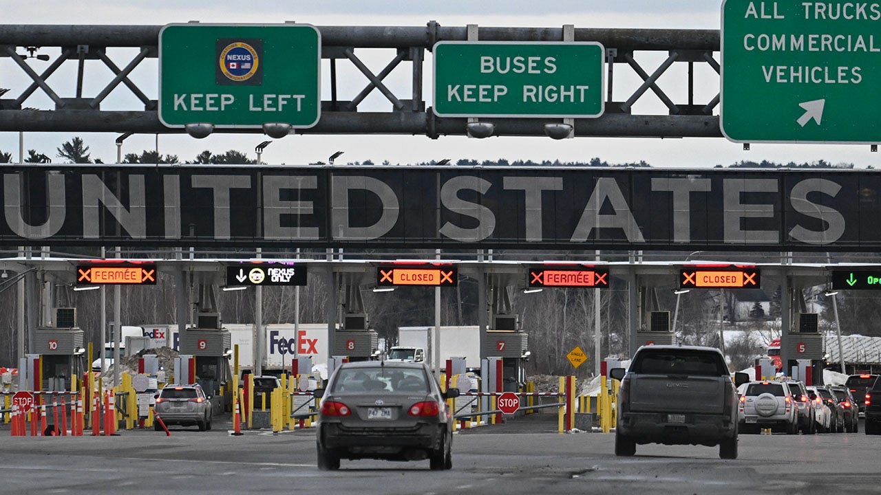 Vehicles in line to cross into the United States at the Canada-US border in St-Bernard-de-Lacolle, Quebec, Canada, on Thursday, March 6, 2025. President Donald Trump exempted Canadian goods covered by the North American trade agreement known as USMCA from his 25% tariffs, offering major reprieves to the US's two largest trading partners. (Graham Hughes/Bloomberg via Getty Images)