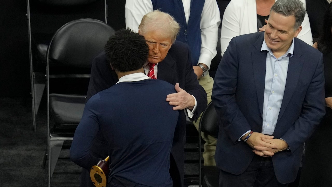 Trump shakes hands with NCAA wrestling champions after title bout