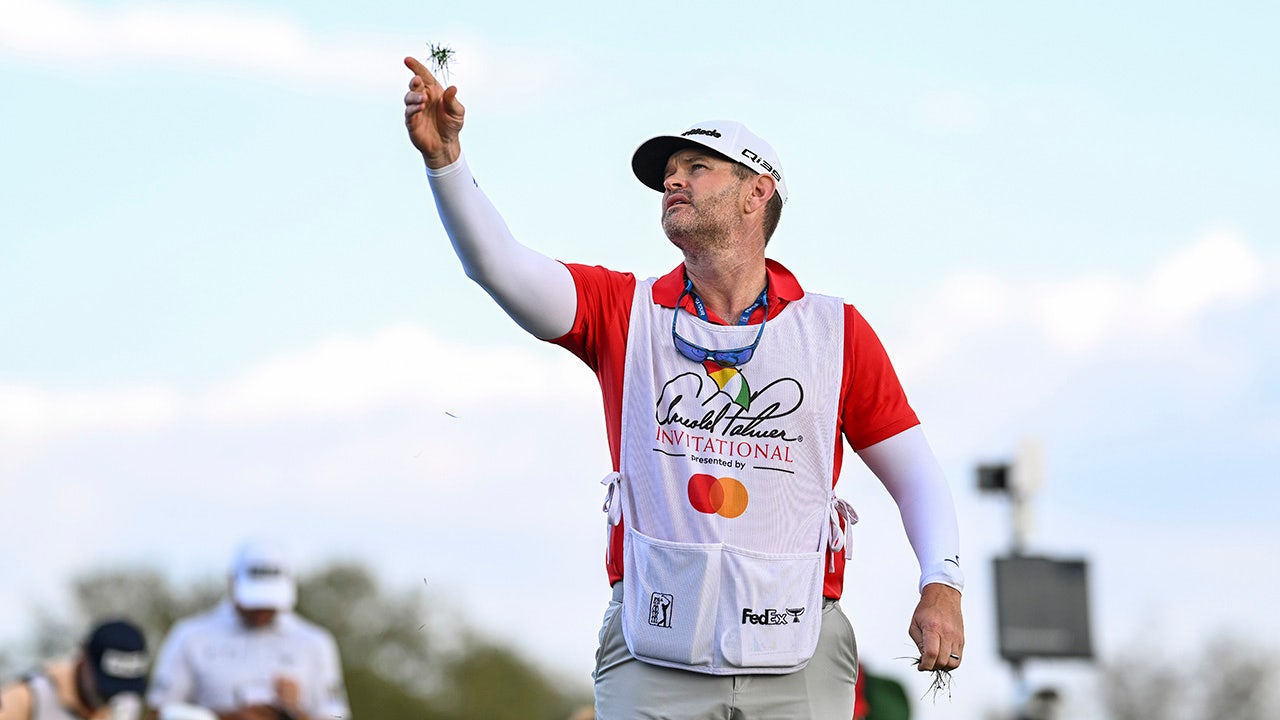 Caddie JJ Jakovac reacts to hole-in-one at TPC Sawgrass