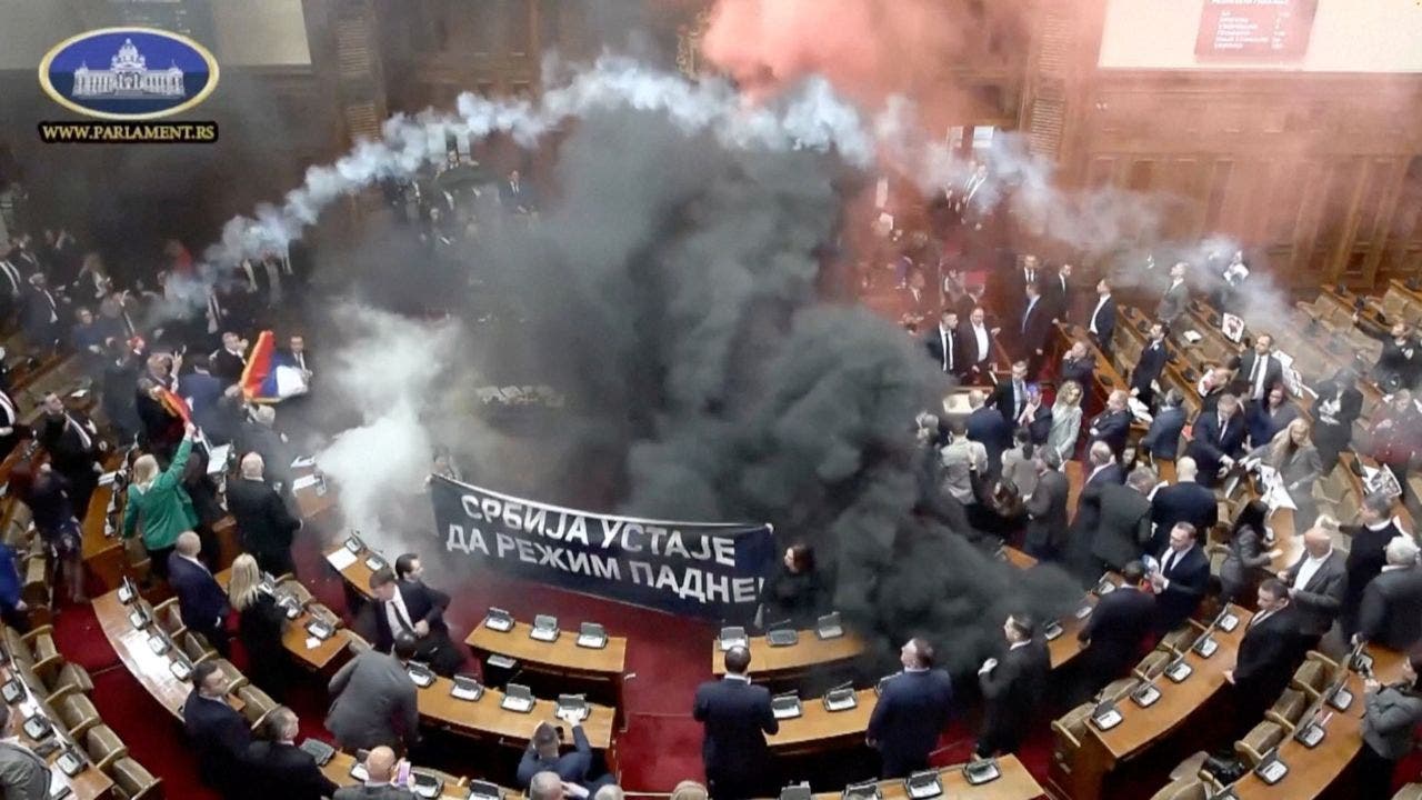 Serbian lawmakers throw smoke grenades, tear gas in parliament