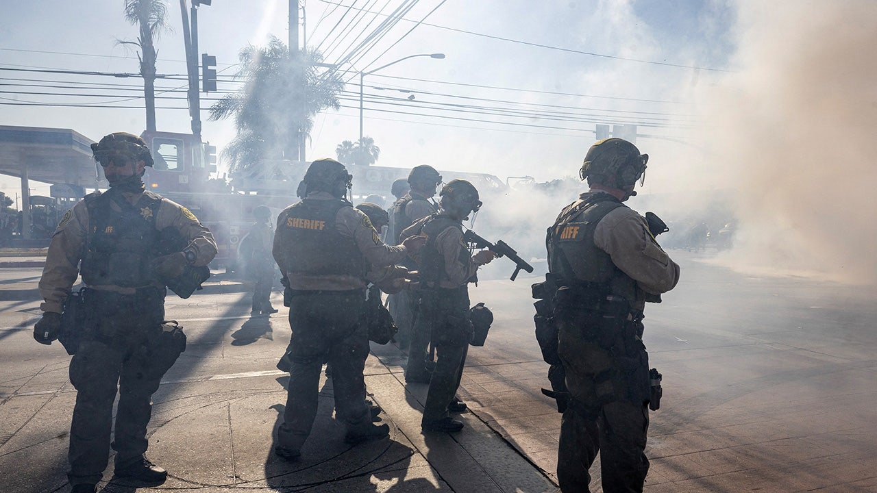 Los Angeles County Sheriff deputies stand guard, during a standoff by protesters and law enforcement following multiple detentions by Immigration and Customs Enforcement (ICE), in the Los Angeles County city of Paramount, California, U.S., June 7, 2025. (REUTERS/Barbara Davidson)