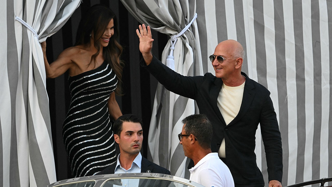 Lauren Snchez and Jeff Bezos were photographed leaving their hotel via water taxi on Thursday. (STEFANO RELLANDINI/AFP via Getty Images)