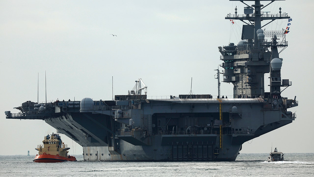 USS Nimitz carrier strike group sailing toward Middle East ahead of schedule, US official says