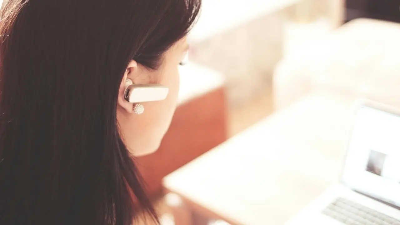 A woman on the phone with customer service. (Kurt 
