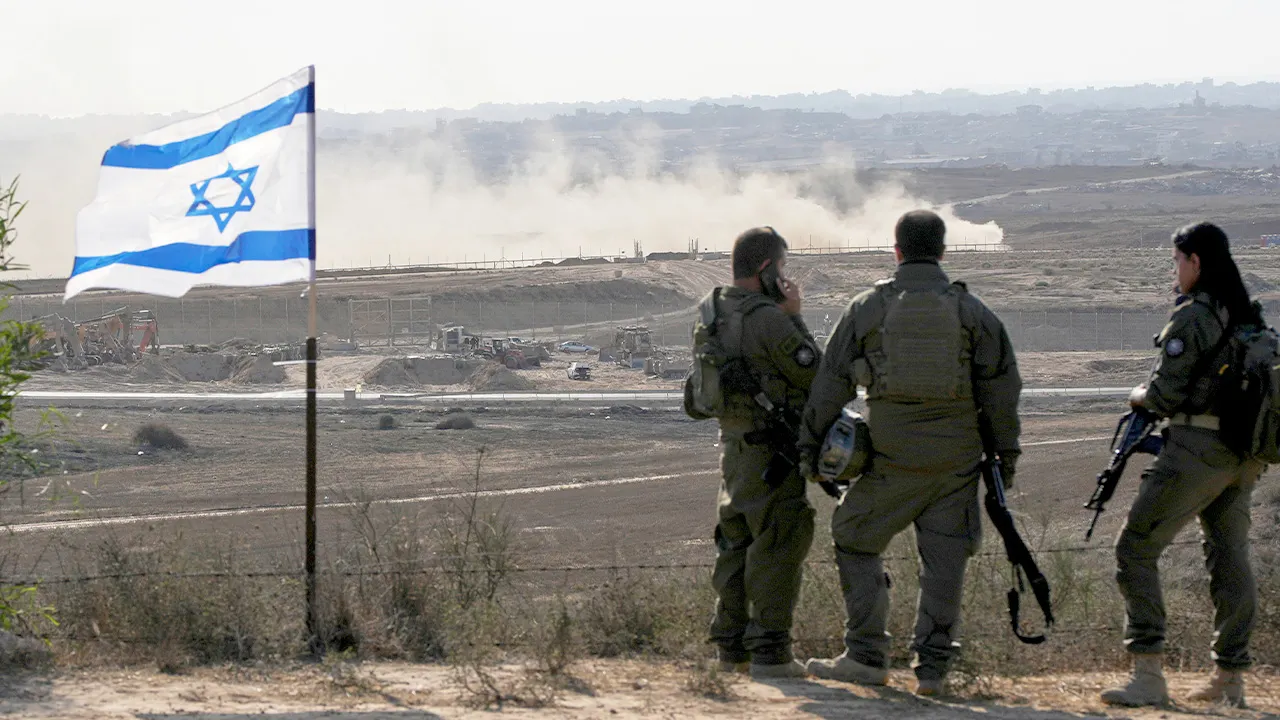 Israeli soldiers watch the northern Gaza Strip from southern Israel, Wednesday, July 30, 2025. (AP Photo/Ohad Zwigenberg)