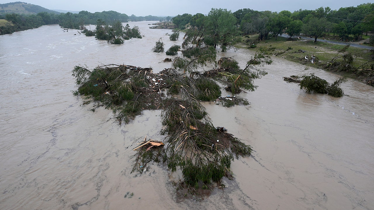 Texas family helps rescue woman clinging to tree after being swept 20 miles downriver