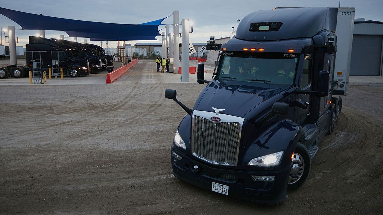 An Aurora Innovation Inc. driverless truck at the company's terminal in Palmer, Texas, US, on Wednesday, Dec. 28, 2023. Driverless trucks with no humans on board will soon cruise Texas, highways if three startup firms have their way, despite objections from critics who say financial pressures, not safety, is behind the timetable. Photographer: Dylan Hollingsworth/Bloomberg via Getty Images