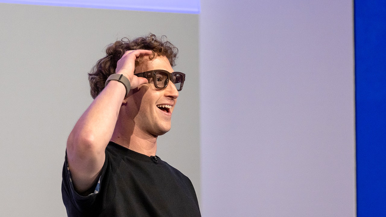 Mark Zuckerberg, chief executive officer of Meta Platforms Inc., wears a pair of Meta Ray-Ban Display AI glasses during the Meta Connect event in Menlo Park, California, US, on Wednesday, Sept. 17, 2025. Meta Platforms, seeking to turn its burgeoning smart glasses into a must-have product unveiled its first version with a built-in screen. (Photographer: David Paul Morris/Bloomberg via Getty Images)