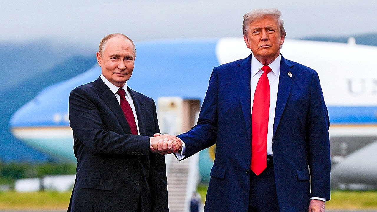 President Donald Trump greets Russia's President Vladimir Putin, Friday, Aug. 15, 2025, at Joint Base Elmendorf-Richardson, Alaska. (Julia Demaree Nikhinson/The Associated Press)