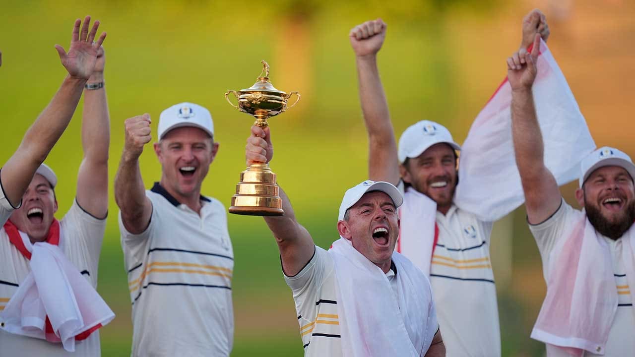 Europe's Rory McIlroy poses with the trophy after winning the Ryder Cup golf tournament against the United States on the Bethpage Black golf course, Sunday, Sept. 28, 2025, in Farmingdale, New York. (AP Photo/Seth Wenig)