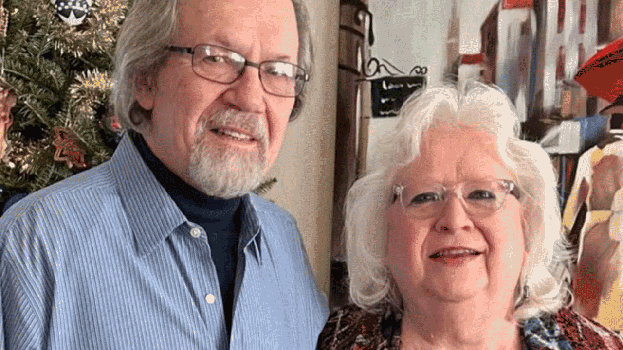 elderly couple posing for photo