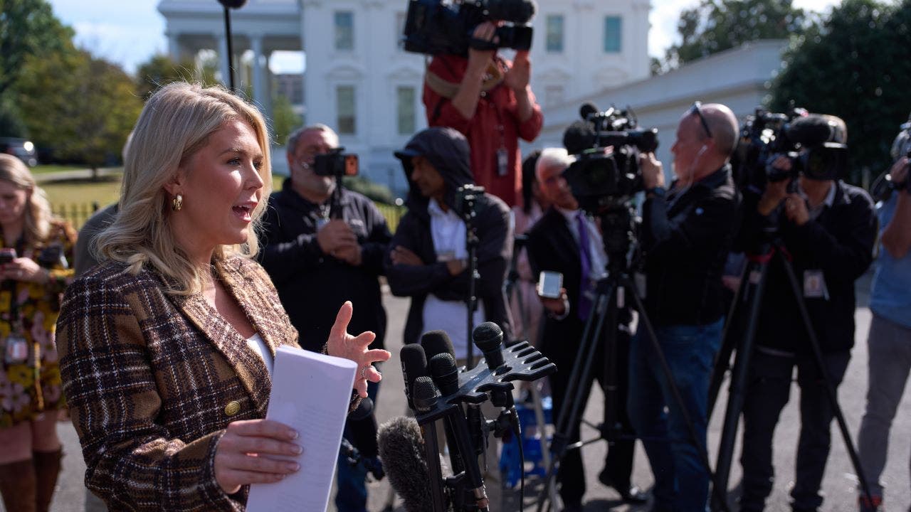 White House press secretary Karoline Leavitt speaks with reporters at the White House, Thursday, Oct. 2, 2025, in Washington. (AP Photo/Evan VuccI)