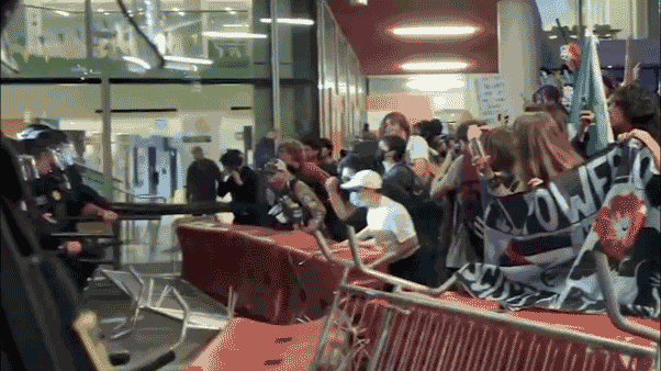 GIF of UC-Berkeley barricade extracurricular  TPUSA event