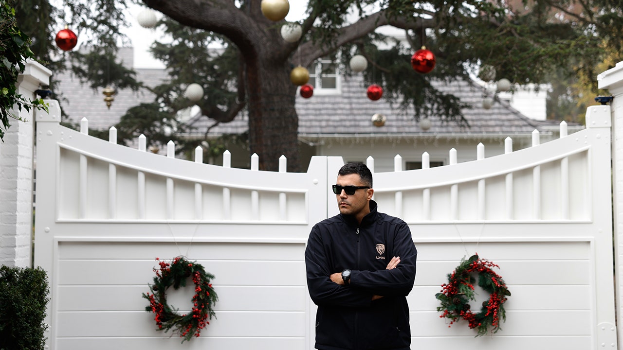 A security guard stands outside Rob Reiner's residence Monday, Dec. 15, 2025, in the Brentwood section of Los Angeles. (Caroline Brehman/AP Photo)