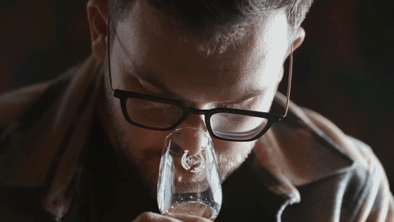 Man trying Utah beer bottle