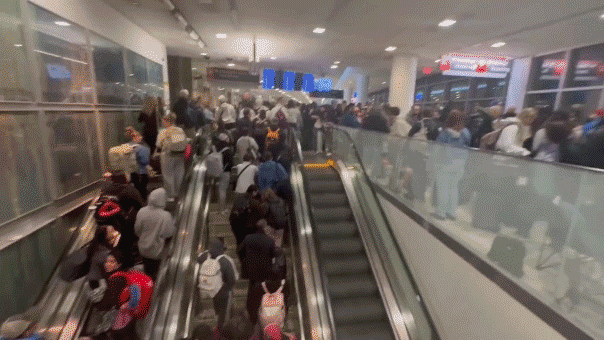 Video captures crazy airport crowds as passengers pour into terminal after security checkpoints close