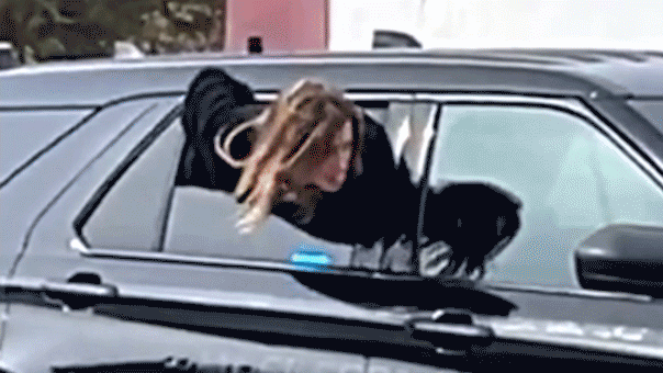 Handcuffed woman who wriggled out of police cruiser window in viral video caught days later