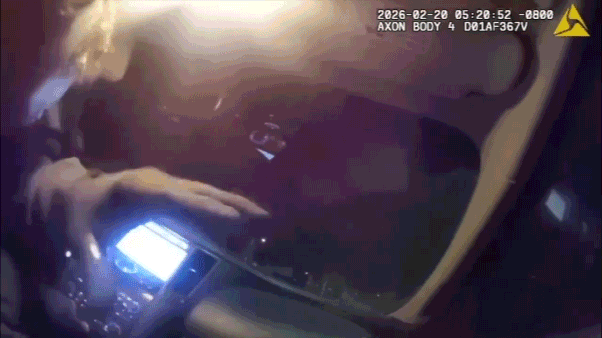 Body camera video shows police officer allegedly kidnapped by armed robbery suspect in roadside showdown