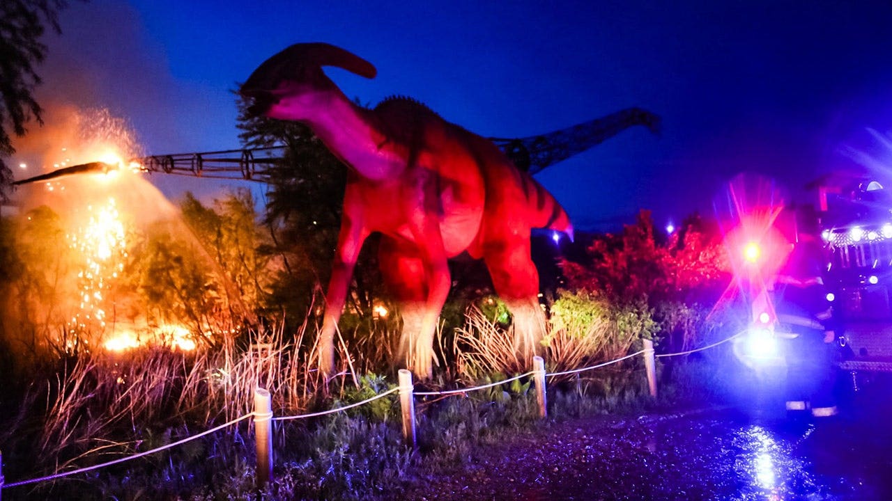 Lightning strike turns 100-foot dinosaur into raging fireball as stunned park visitors look on